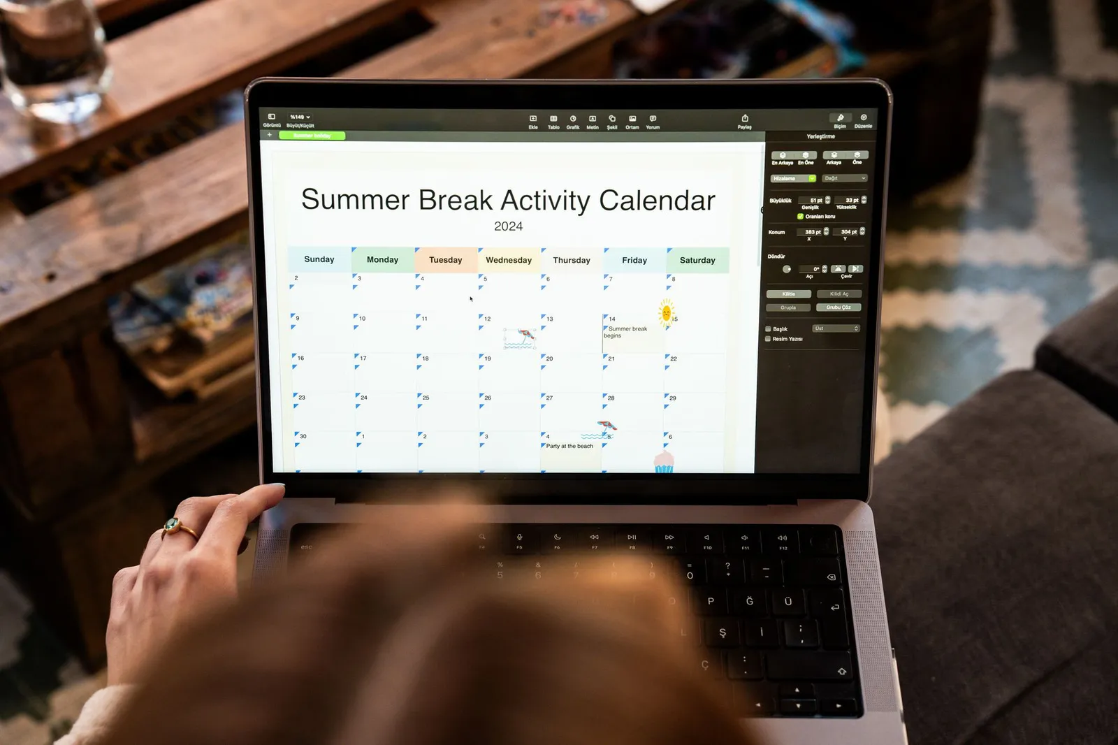 A phone and laptop showing a calendar with bookings