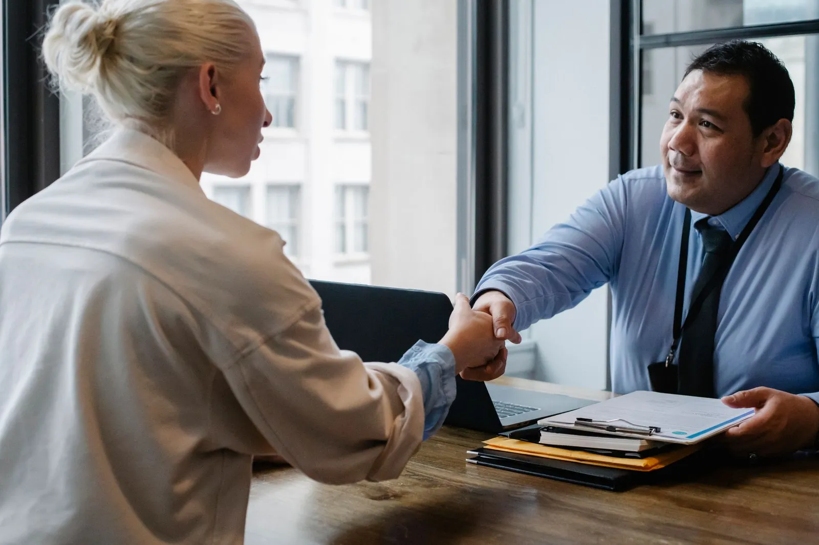 A coach greeting a new client at the start of a session